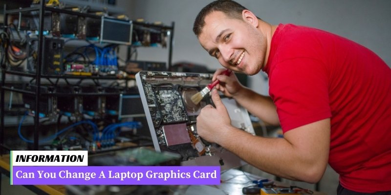 A man intently working on a laptop, specifically on a graphics card.