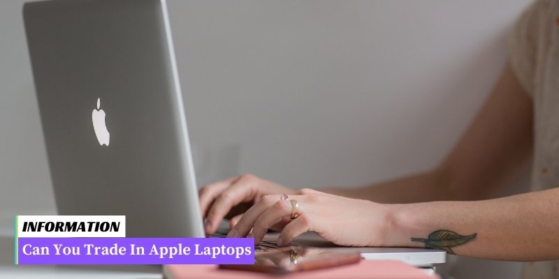 A woman typing on a laptop with the words "Can you trade in Apple laptops?" - seeking information on trading in Apple laptops.