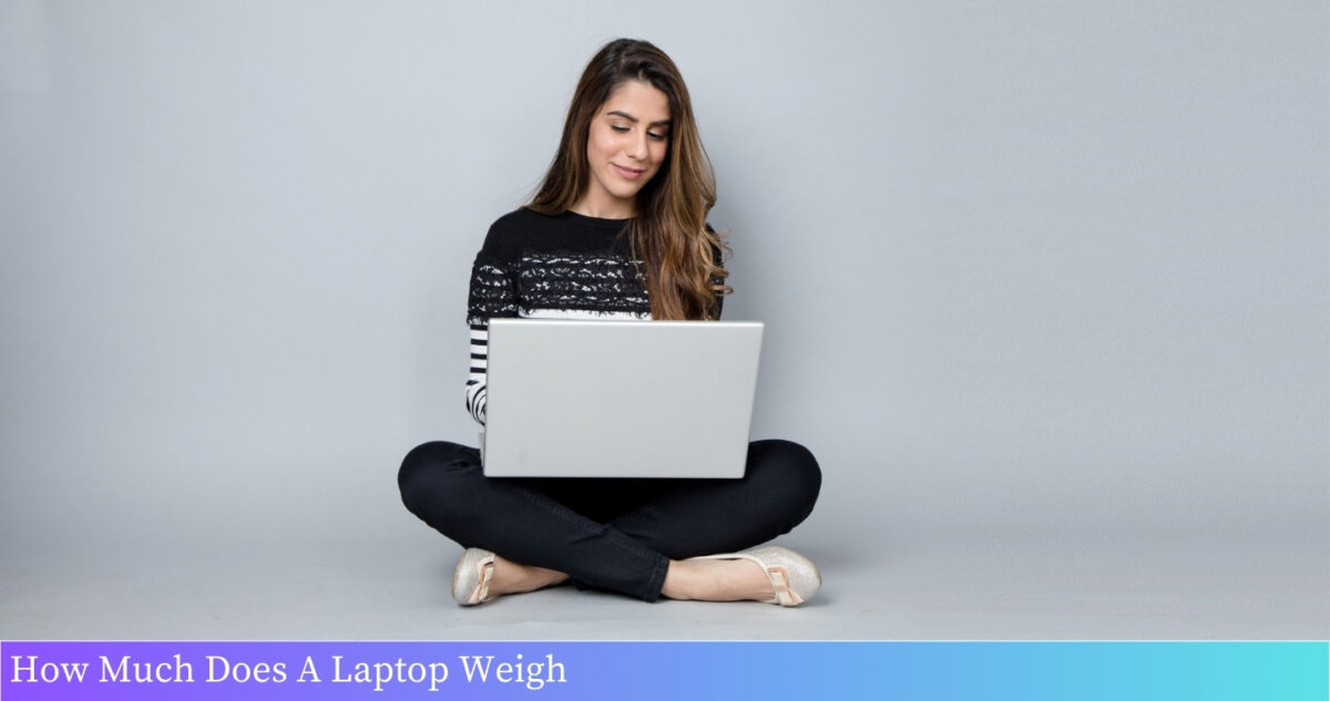 A laptop on a scale, weighing 3.5 pounds.